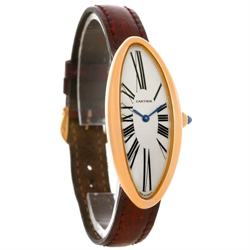 This image shows a Cartier Baignoire Women's Rose Gold Silver Dial Women's Rose Gold Silver Dial watch at a slight angle, highlighting its elongated oval face, Roman numeral markers, and brown leather strap.