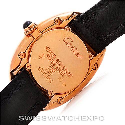 The image shows the back of the Cartier Baignoire Women's Rose Gold Pink Dial Women's Rose Gold Pink Dial watch and part of its black leather strap.