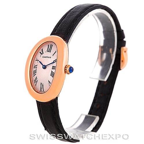 This image shows a side angle of a Cartier Baignoire Women's Rose Gold Pink Dial Women's Rose Gold Pink Dial watch, highlighting the oval face, Roman numerals, and black leather strap.