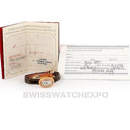 The image shows a Cartier Baignoire WB501651 Women's Yellow Gold Silver Dial WB501651 Women's Yellow Gold Silver Dial watch from an overhead angle, along with its international warranty certificate and purchase receipt.