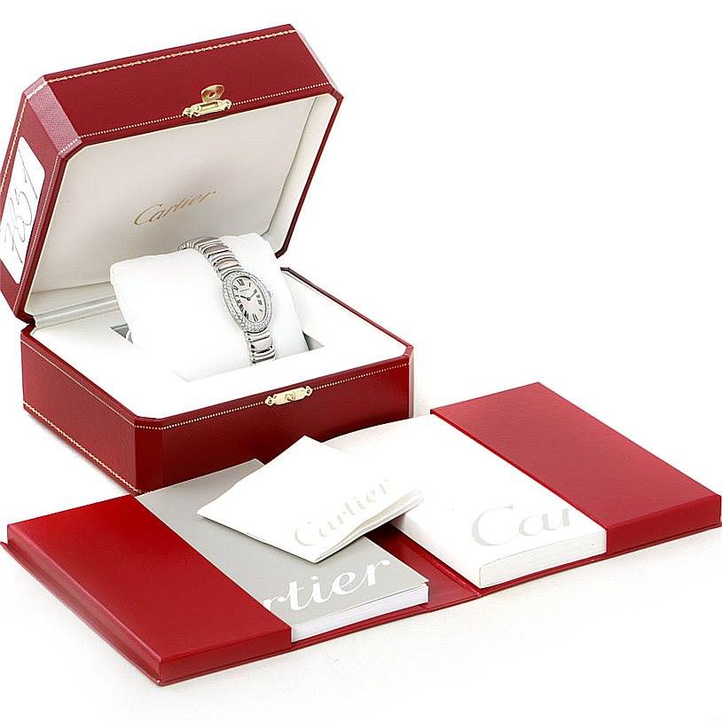 The Cartier Baignoire WB5097L2 Women's White Gold Silver Dial WB5097L2 Women's White Gold Silver Dial watch is displayed at a frontal angle in its red box, along with branded booklets and packaging.