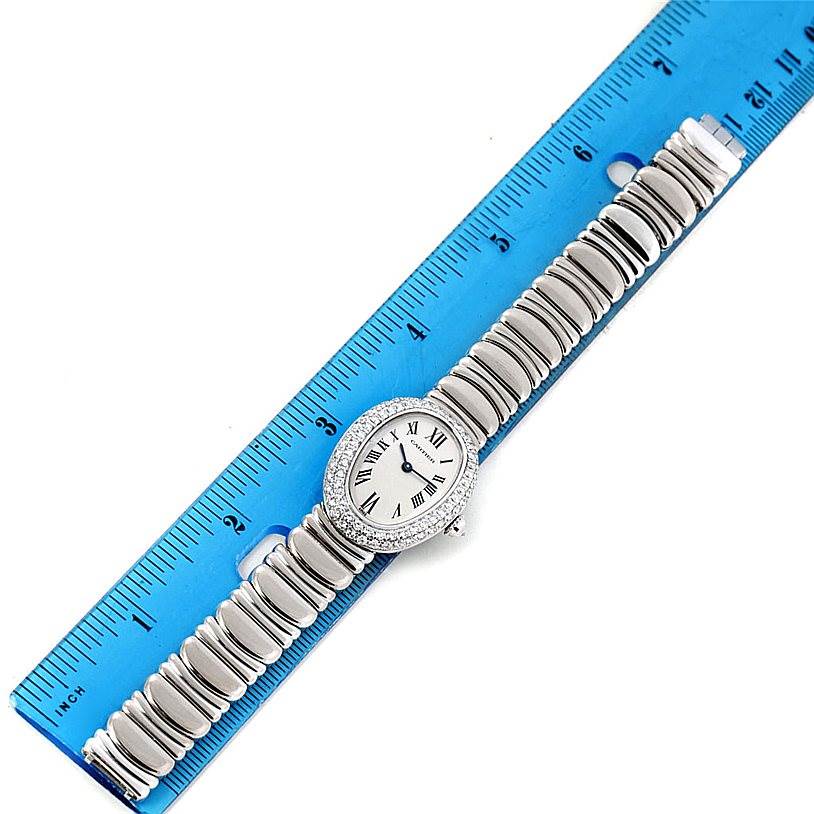 This Cartier Baignoire WB5097L2 Women's White Gold Silver Dial WB5097L2 Women's White Gold Silver Dial watch is shown from a top-down angle with a blue ruler for size reference.