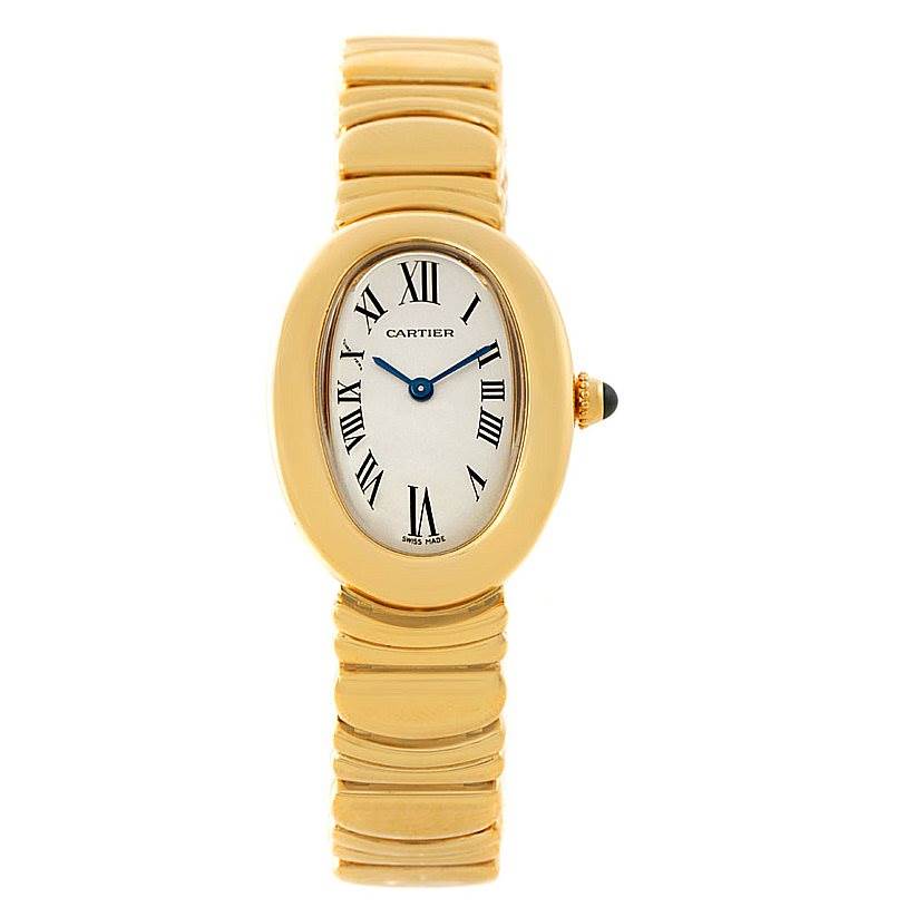 The image shows a frontal view of a Cartier Baignoire W15045D8 Women's Yellow Gold Silver Dial W15045D8 Women's Yellow Gold Silver Dial watch, highlighting its oval face, gold bracelet, and Roman numeral dial.