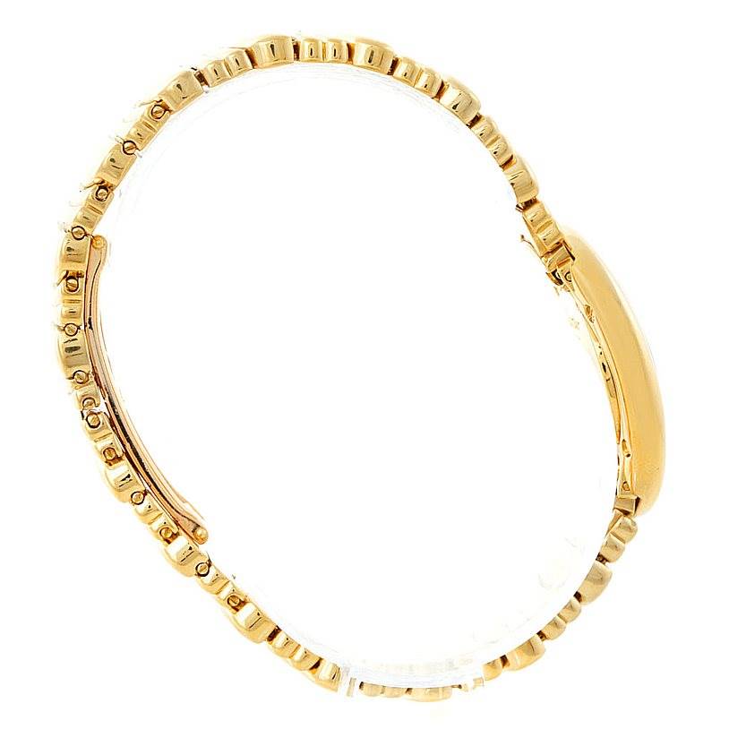 The image shows a side view of the Cartier Baignoire W15045D8 Women's Yellow Gold Silver Dial W15045D8 Women's Yellow Gold Silver Dial watch, highlighting its gold bracelet and case profile.