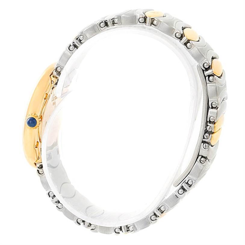 This image shows a side view of the Cartier Baignoire W15045D8 Women's Yellow Gold Silver Dial W15045D8 Women's Yellow Gold Silver Dial watch with a focus on its gold and stainless steel bracelet and blue crown.