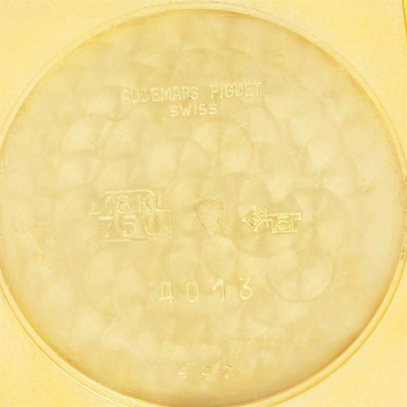 This image shows the inside caseback of a Vintage Audemars Piguet watch with hallmarks and inscriptions.