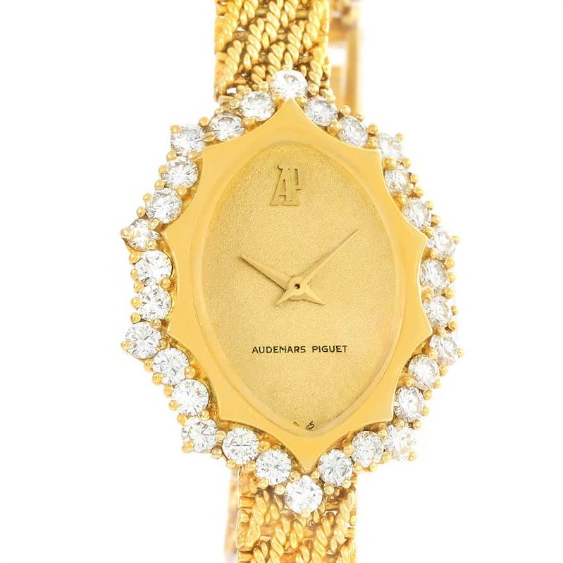 This image shows a close-up of the face and upper bracelet of a Vintage Audemars Piguet watch adorned with diamonds.