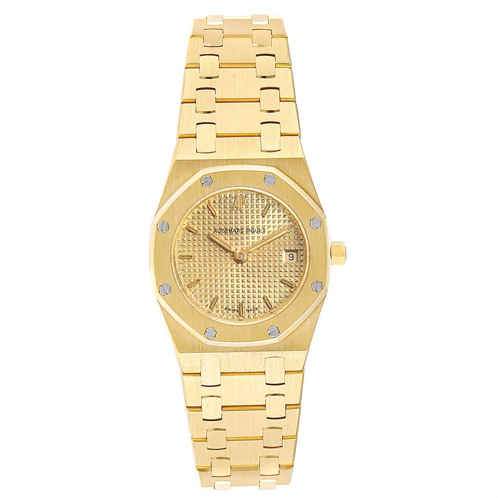 The image shows a front view of an Audemars Piguet Royal Oak 67075BA.OO.1100BA.06 Women's Yellow Gold Champagne Dial 67075BA.OO.1100BA.06 Women's Yellow Gold Champagne Dial watch, highlighting the face, bezel, bracelet, and date window.