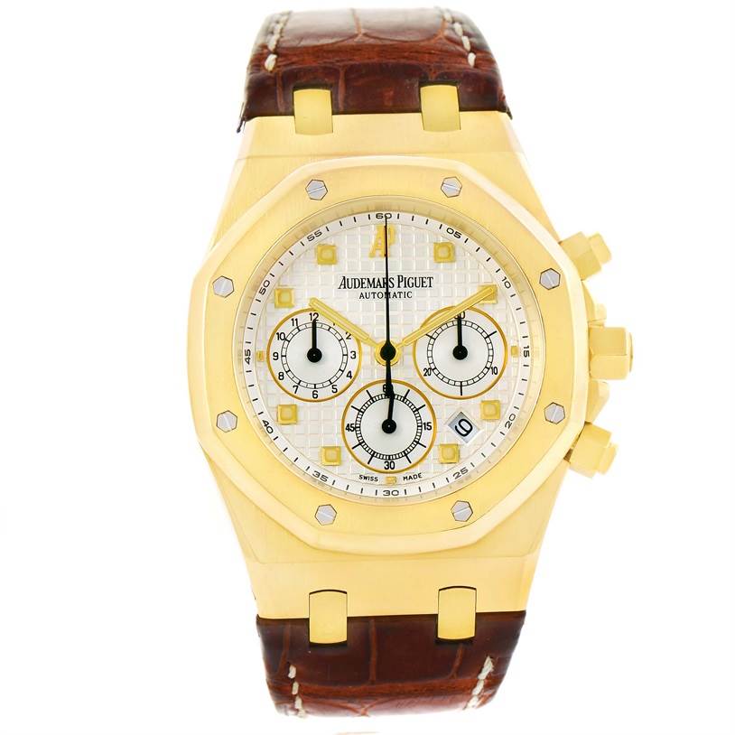 This image shows a front view of the Audemars Piguet Royal Oak 26022BA.OO.D088CR.01 Men's Yellow Gold Silver Dial 26022BA.OO.D088CR.01 Men's Yellow Gold Silver Dial watch with a gold case and brown leather strap.