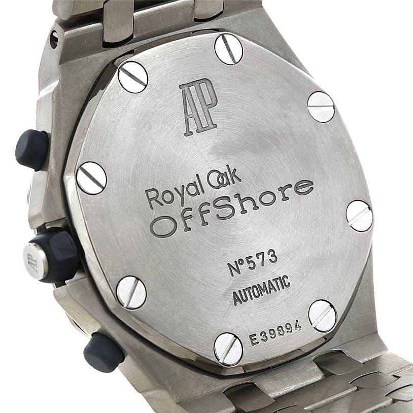 The image shows the back case of the Audemars Piguet Royal Oak 25721TI.0.1000TI.01 Men's Titanium Grey Dial 25721TI.0.1000TI.01 Men's Titanium Grey Dial Offshore watch, highlighting its engravings and screws.