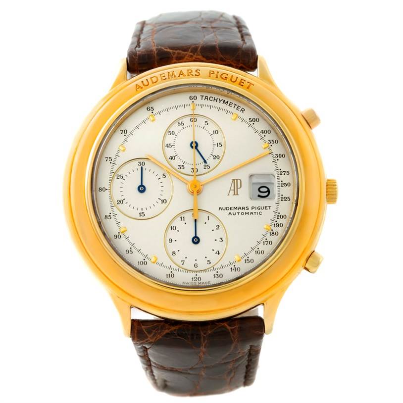 The image shows a front view of a Vintage Audemars Piguet watch with a leather strap and gold casing.
