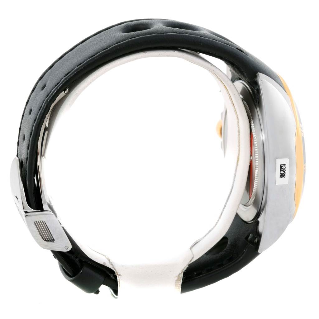 The image shows a Tudor Grantour 20551N Men's Steel and Gold (two tone) Black Dial 20551N Men's Steel and Gold (two tone) Black Dial watch from a side profile, highlighting its leather strap and case.