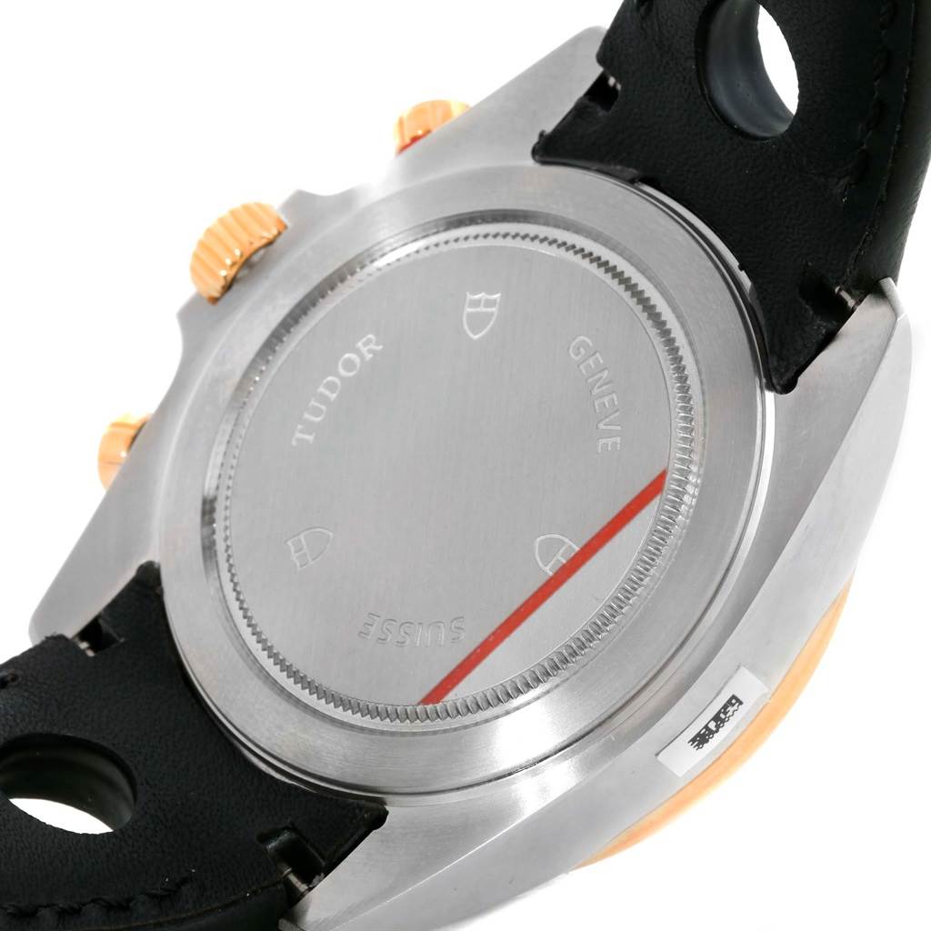 The image shows the back and side view of the Grantour model watch by Tudor, featuring the case back and parts of the strap and buttons.