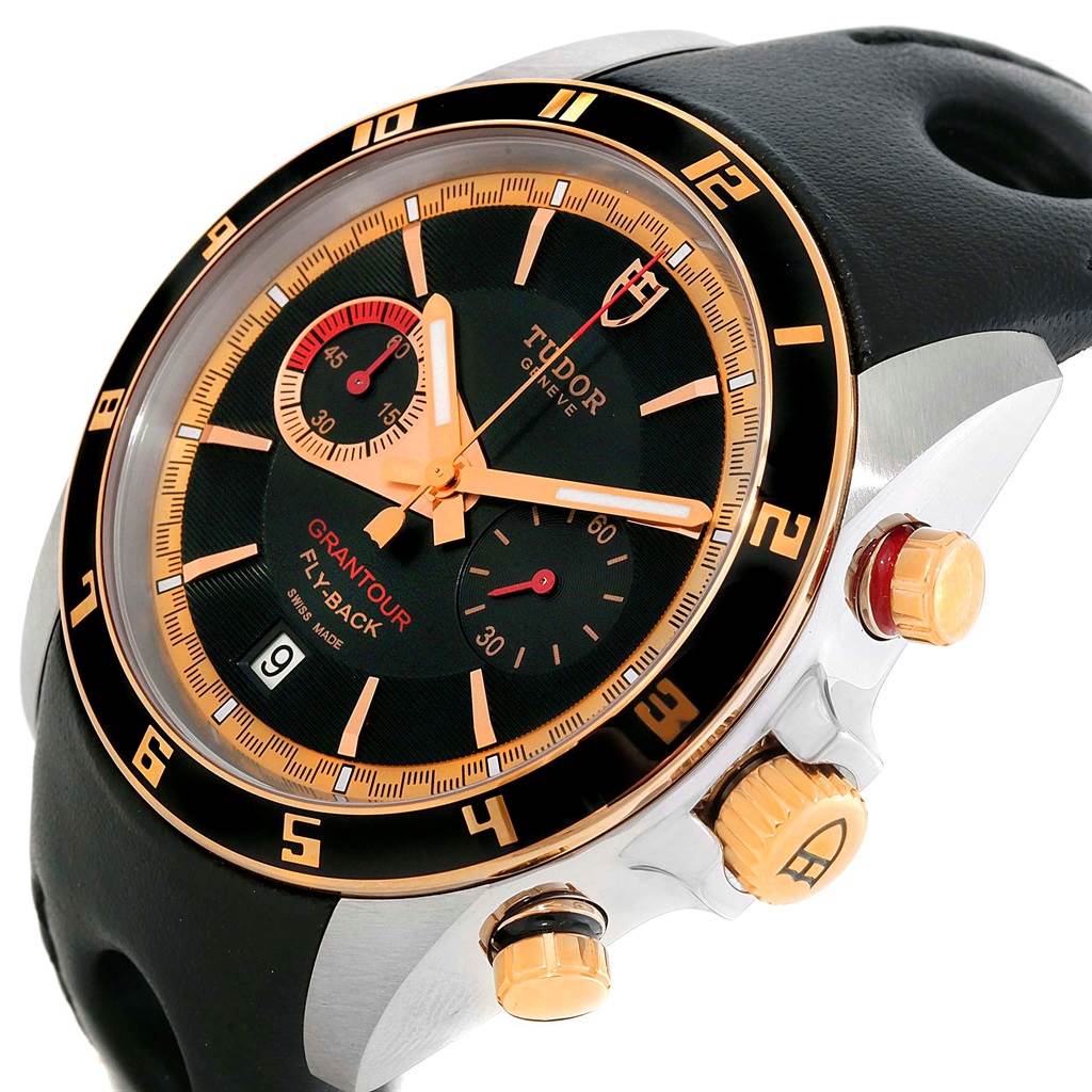 The image shows a Tudor Grantour 20551N Men's Steel and Gold (two tone) Black Dial 20551N Men's Steel and Gold (two tone) Black Dial watch at an angle highlighting the dial, bezel, pushers, and part of the strap.