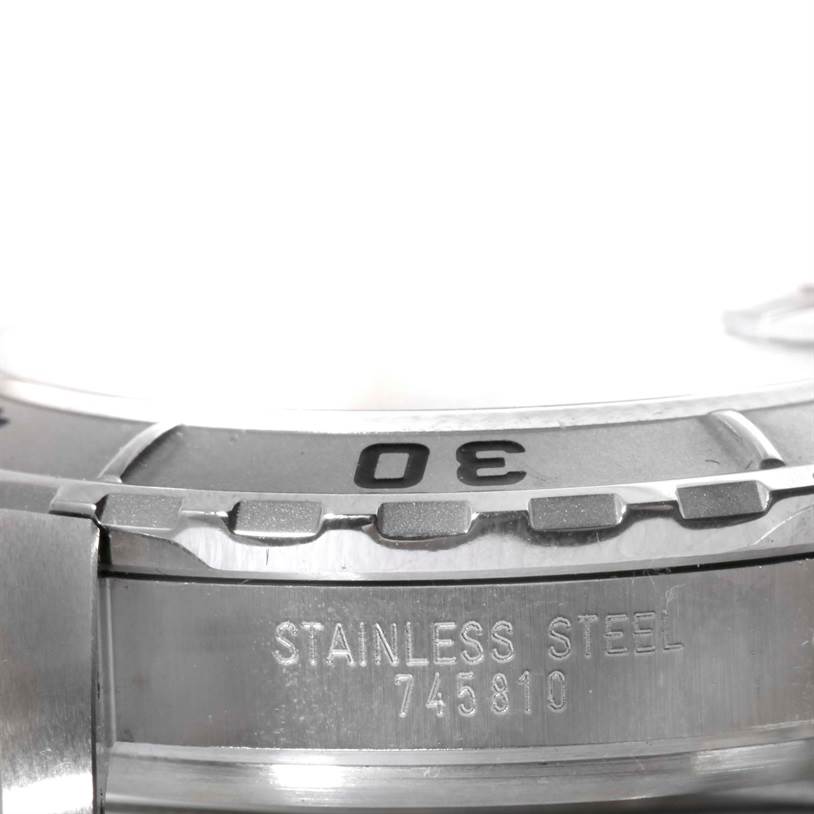 The image shows a close-up of the bezel
s edge and a portion of the case back of the Tudor Hydronaut 89190 Men
s Stainless Steel Yellow Dial 89190 Men
s Stainless Steel Yellow Dial watch.