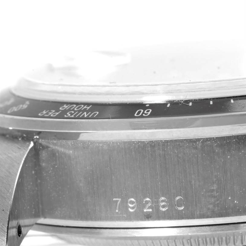 This image shows a close-up side view of the Tudor Prince model 79260 watch, featuring part of the bezel and case with the serial number.
