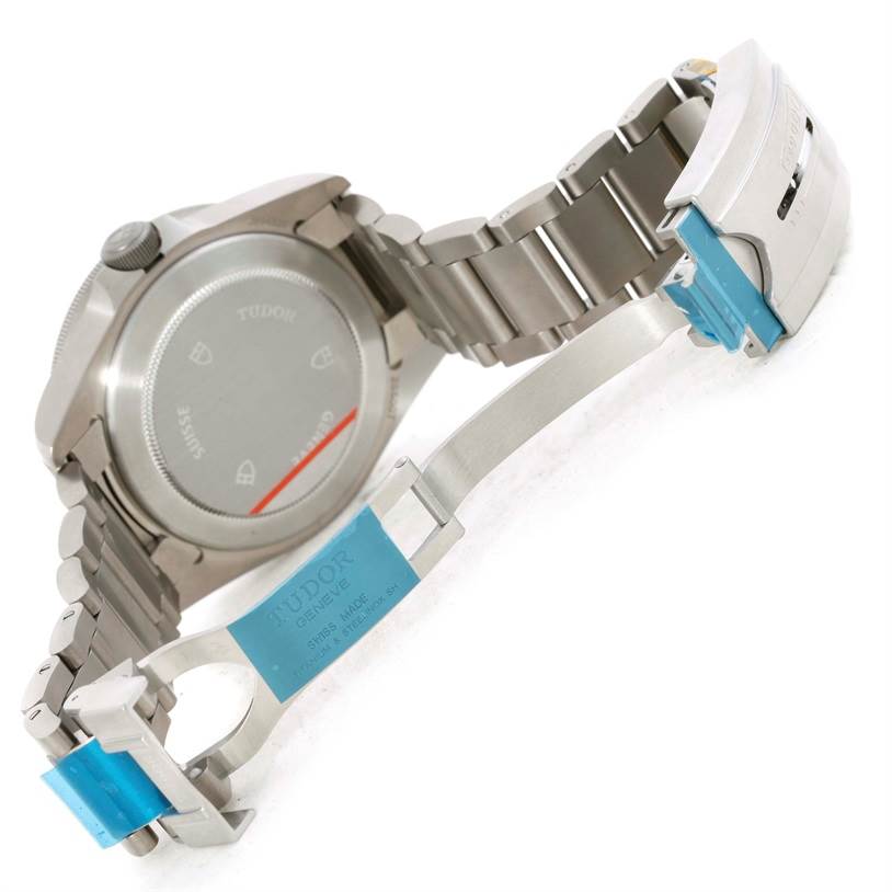 This image shows the back view of a Tudor Pelagos 25500TN Men's Titanium Black Dial 25500TN Men's Titanium Black Dial watch, highlighting the case back and partially open stainless steel bracelet.