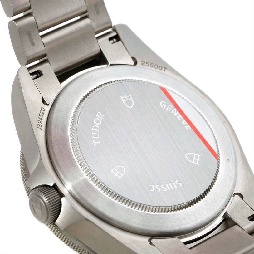 The image shows the back case and part of the bracelet of a Tudor Pelagos 25500TN Men's Titanium Black Dial 25500TN Men's Titanium Black Dial watch at an angle.