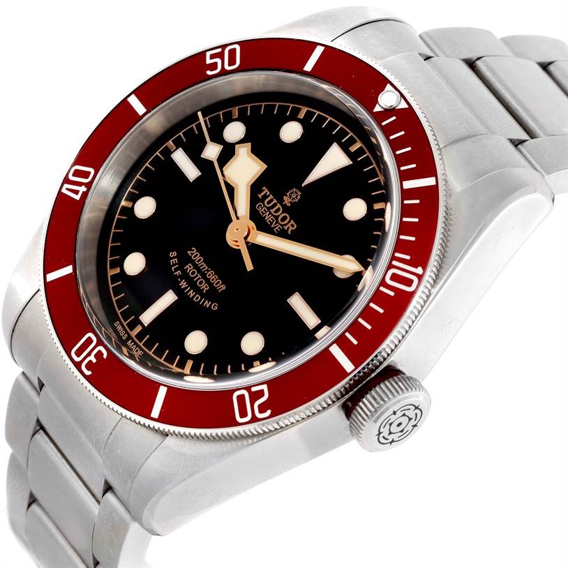 This image shows the face, bezel, crown, and part of the bracelet of the Tudor Heritage Black Bay 79220R Men's Stainless Steel Black Dial 79220R Men's Stainless Steel Black Dial watch at an angled side view.