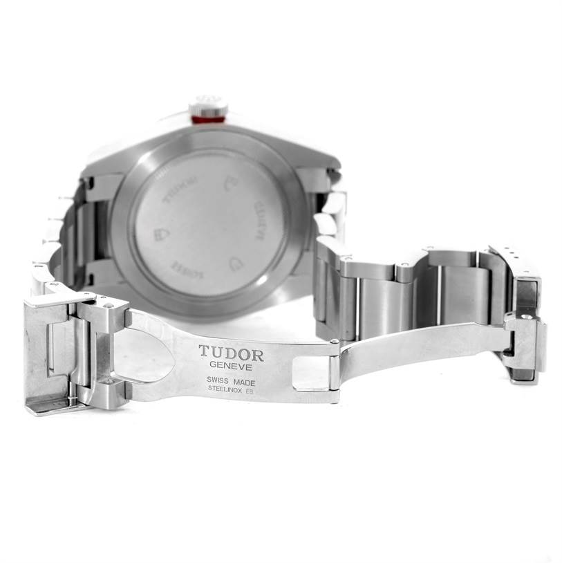 The image shows the back and opened clasp of a Tudor Heritage Black Bay 79220R Men's Stainless Steel Black Dial 79220R Men's Stainless Steel Black Dial watch, highlighting the case back and stainless steel bracelet.