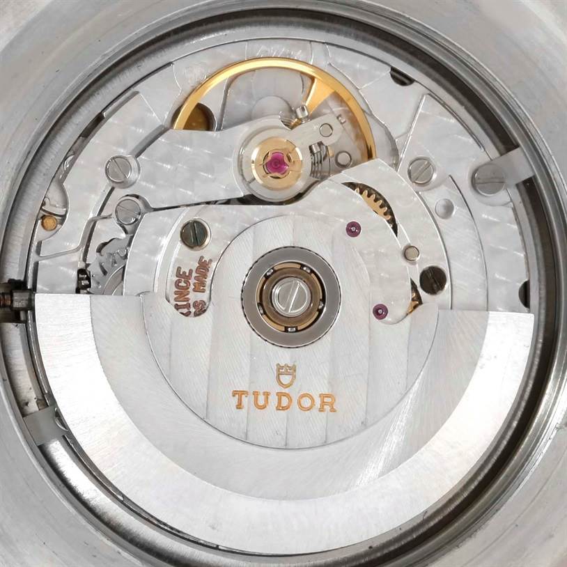 The image shows a close-up of the watch movement of a Tudor Submariner 79090 Men's Stainless Steel Black Dial 79090 Men's Stainless Steel Black Dial model, highlighting the intricate mechanisms.