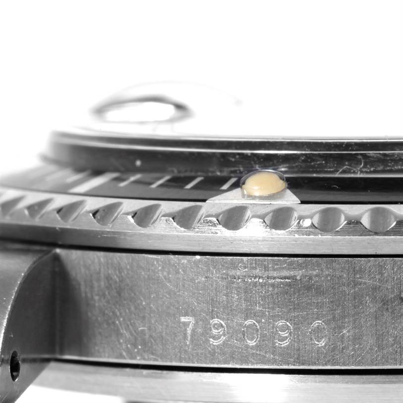 The image shows a close-up of the bezel, crystal, and case side of a Tudor Submariner 79090 Men's Stainless Steel Black Dial 79090 Men's Stainless Steel Black Dial watch, model 79090.