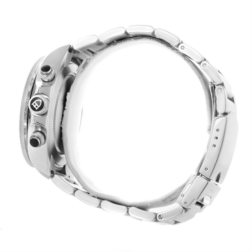 The image shows a side view of a Tudor Heritage Chrono 70330N-95740 Men's Stainless Steel Black Dial 70330N-95740 Men's Stainless Steel Black Dial watch, highlighting the crown, pushers, and the metal bracelet.