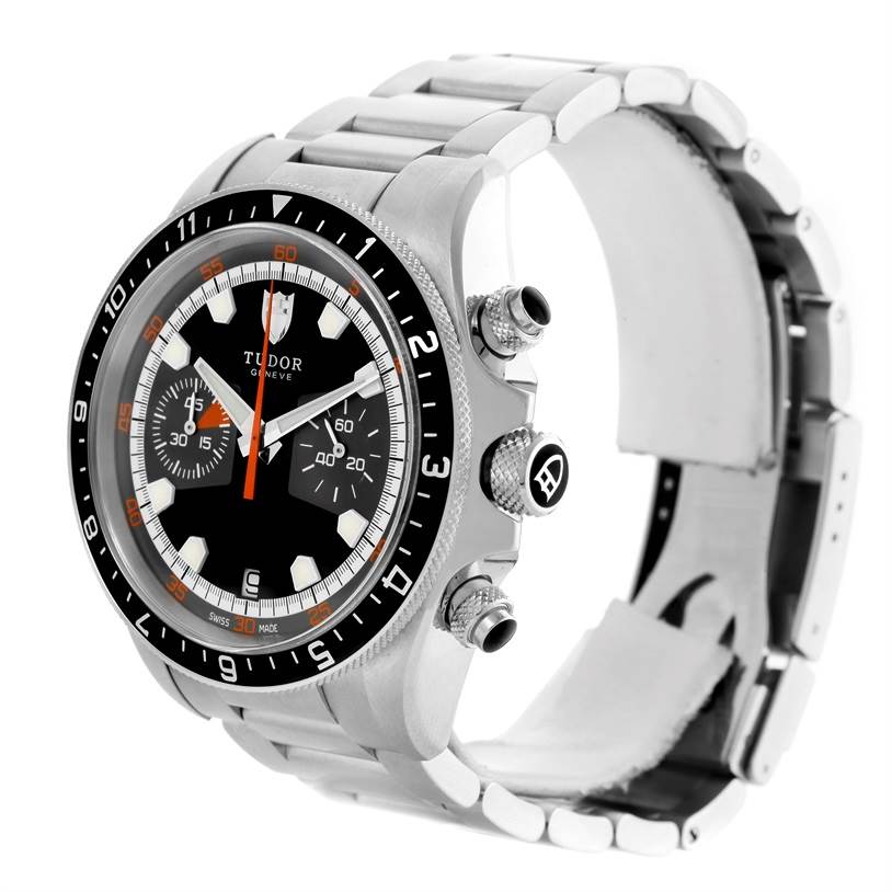 The Tudor Heritage Chrono 70330N-95740 Men's Stainless Steel Black Dial 70330N-95740 Men's Stainless Steel Black Dial watch is shown from a front-side angle, displaying its dial, bezel, pushers, and the metal bracelet.