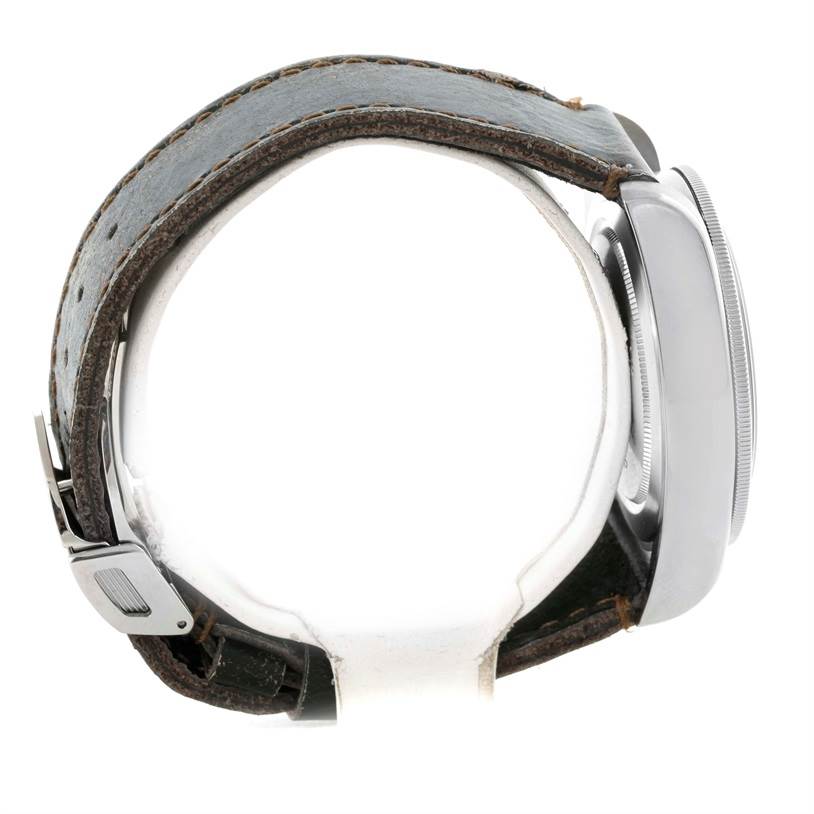 The image shows a Tudor Heritage Black Bay 79220R Men's Stainless Steel Black Dial 79220R Men's Stainless Steel Black Dial watch from a side angle, highlighting the case and leather strap.