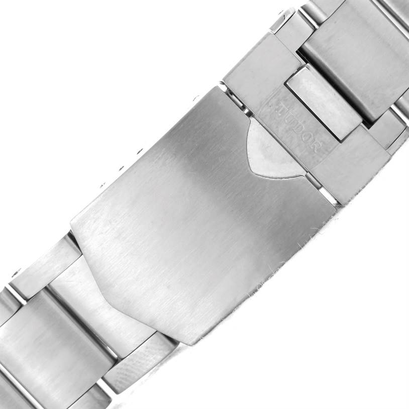 The image shows a close-up angle of the clasp of the Tudor Heritage Black Bay 79220 Men's Stainless Steel Black Dial 79220 Men's Stainless Steel Black Dial watch's stainless steel bracelet.
