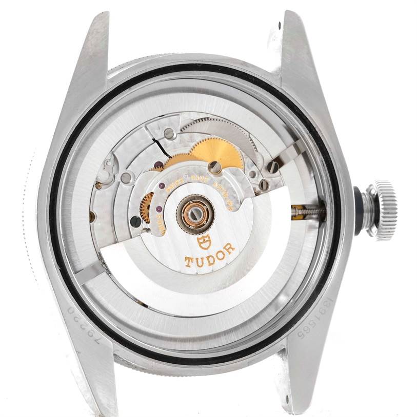 This image shows the internal mechanism of the Tudor Heritage Black Bay 79220 Men's Stainless Steel Black Dial 79220 Men's Stainless Steel Black Dial watch from a back angle, exposing its movement parts.