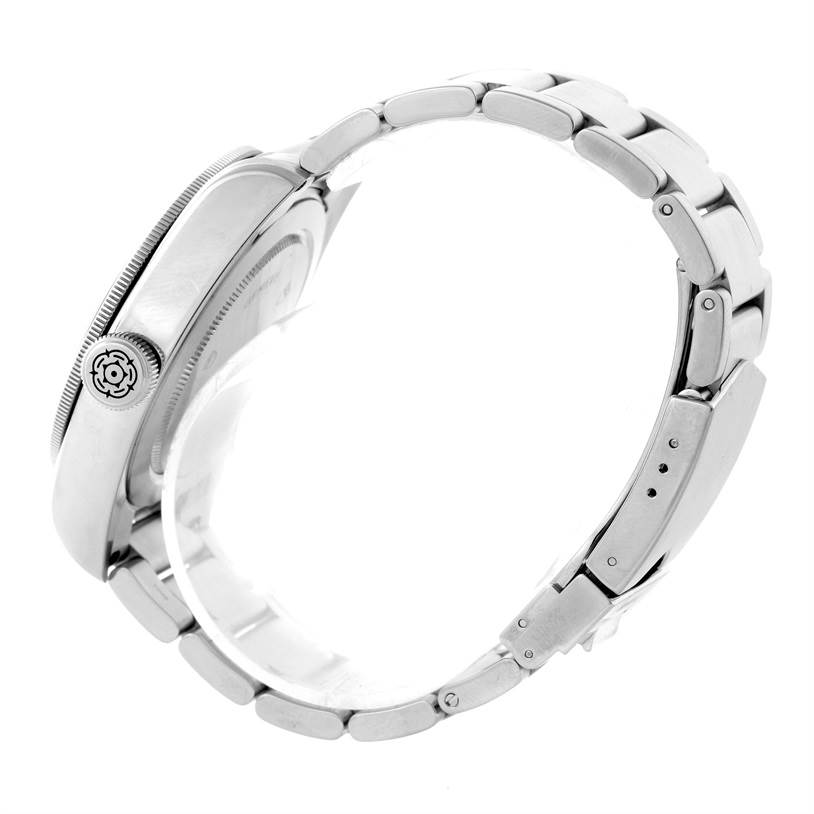 This side view of the Tudor Heritage Black Bay 79220 Men's Stainless Steel Black Dial 79220 Men's Stainless Steel Black Dial watch shows the stainless steel case, crown, and bracelet.