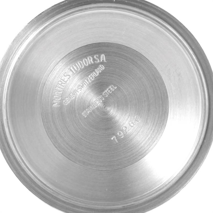 This image shows the engraved stainless steel case back of a Tudor Tiger 79273 Men's Stainless Steel White Dial 79273 Men's Stainless Steel White Dial model watch, viewed from the inside.