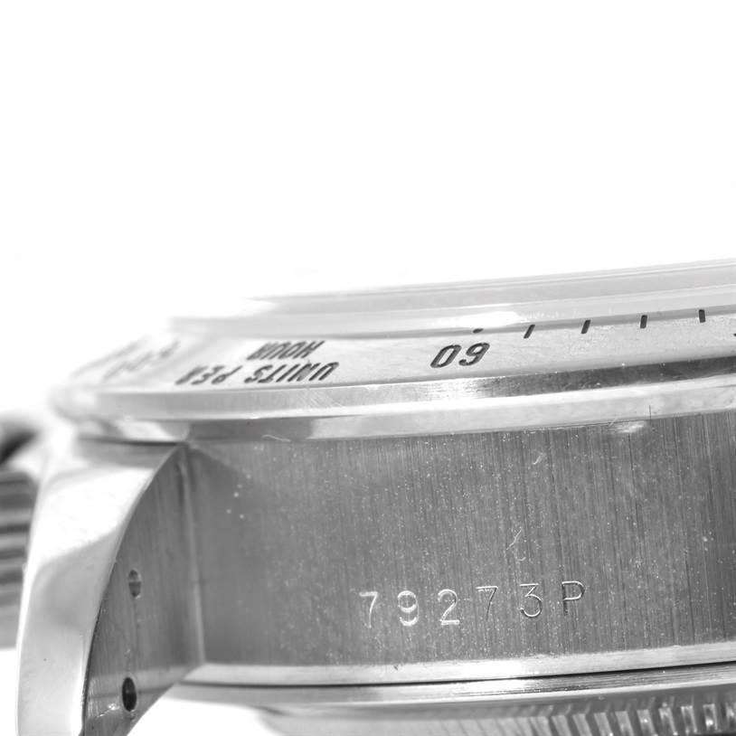 The image shows a close-up side angle of the bezel and case, revealing the serial number, of the Tudor Tiger 79273 Men's Stainless Steel White Dial 79273 Men's Stainless Steel White Dial model watch.