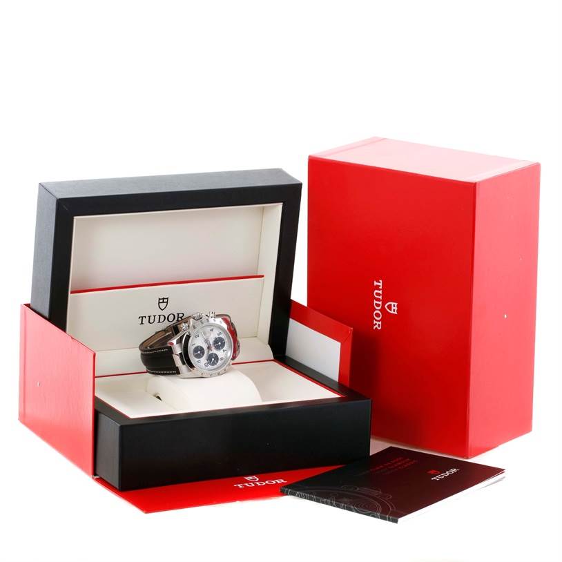 The image shows a Tudor Tiger 79273 Men's Stainless Steel White Dial 79273 Men's Stainless Steel White Dial model watch in an open box with packaging and documents displayed.