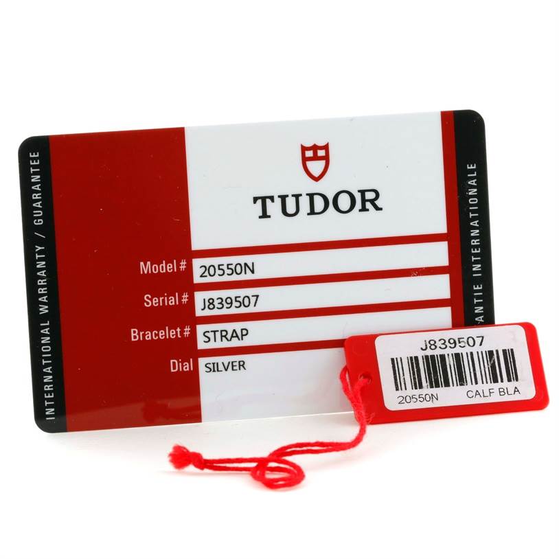 The image shows a warranty card and tag for a Tudor Grantour 20550N Men's Stainless Steel Grey Dial 20550N Men's Stainless Steel Grey Dial watch model #20550N with serial #J839507.