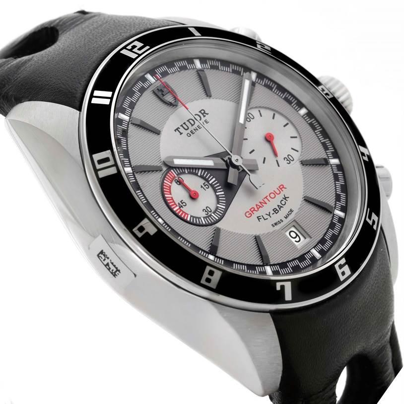 The image shows a close-up of the Tudor Grantour 20550N Men's Stainless Steel Grey Dial 20550N Men's Stainless Steel Grey Dial watch, focusing on the dial, bezel, and part of the leather strap at an angle.