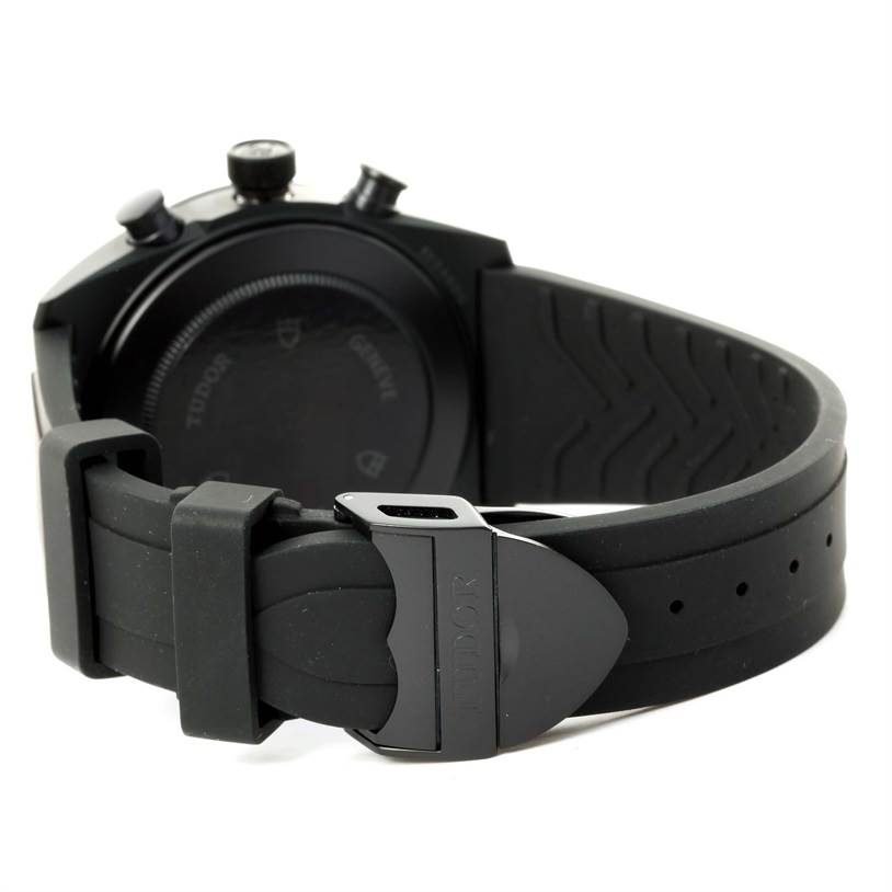 The image shows the Tudor Fastrider 42000CR Men's Stainless Steel Black Dial 42000CR Men's Stainless Steel Black Dial watch from the back, focusing on the clasp and rubber strap.