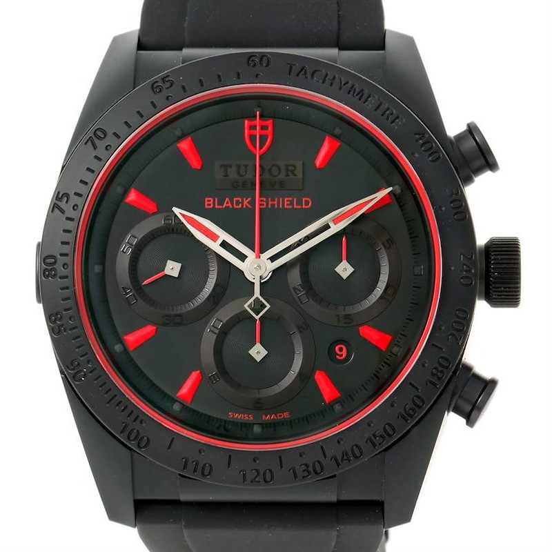 The image shows a front view of the Tudor Fastrider Black Shield watch, including the dial, bezel, and chronograph sub-dials.