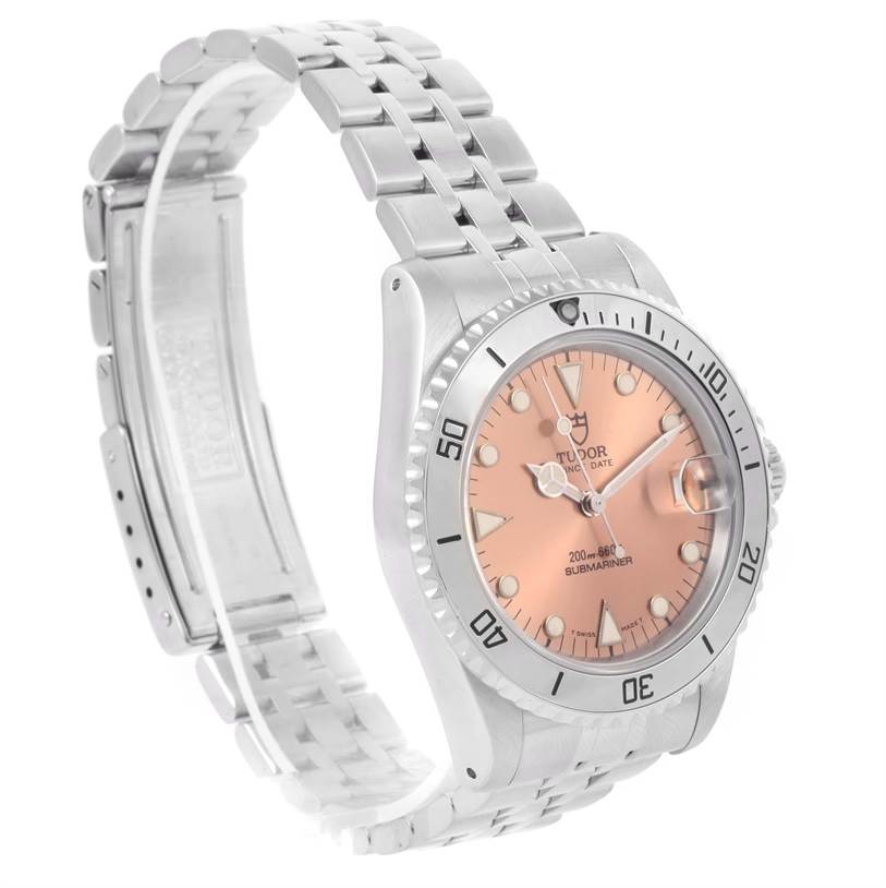 The image shows a Tudor Submariner 75190 Men's Stainless Steel Pink Dial 75190 Men's Stainless Steel Pink Dial watch at an angle highlighting the bracelet, bezel, and dial.