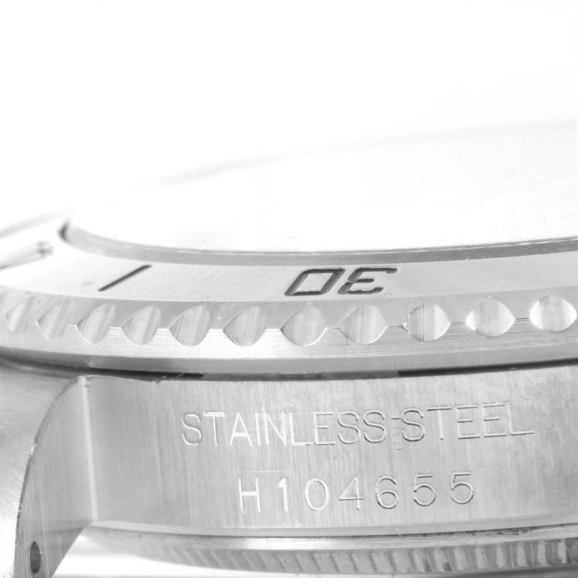 The image shows a close-up of the stainless steel case side and bezel of a Tudor Submariner 75190 Men's Stainless Steel Pink Dial 75190 Men's Stainless Steel Pink Dial watch, highlighting the serial number.