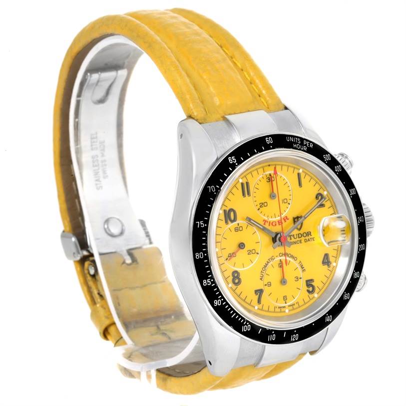The image shows a Tudor Prince model watch at a three-quarter angle, highlighting its yellow dial, leather strap, and side buttons.