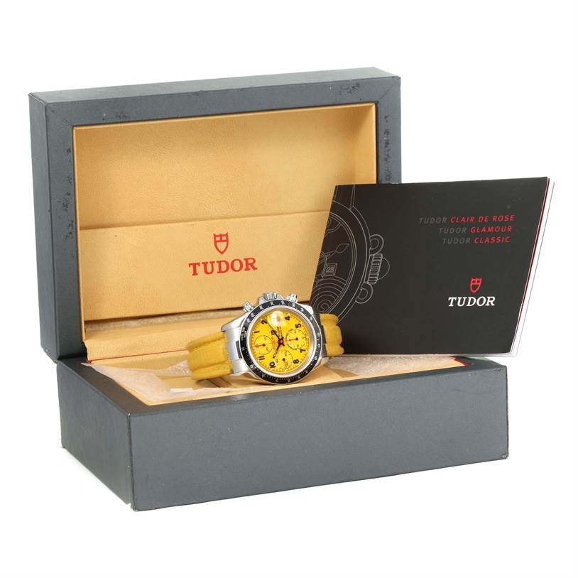 The Prince model by Tudor is displayed in its box, along with manuals, showing a frontal view of the watch.