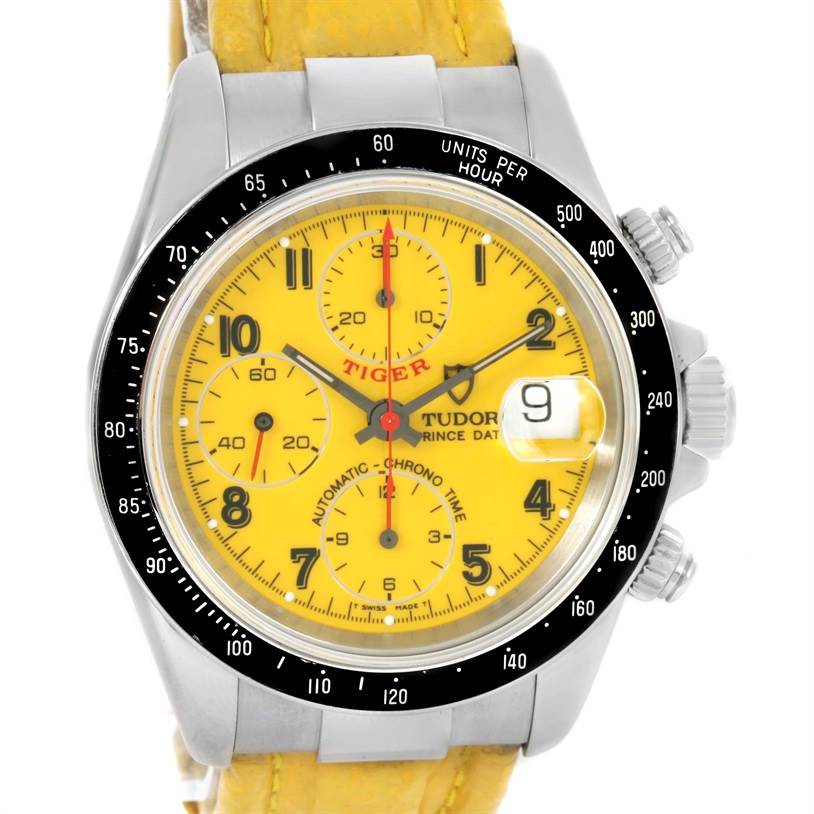 The image shows a close-up, frontal view of the Tudor Prince Tiger watch, highlighting the yellow dial and chronograph features.