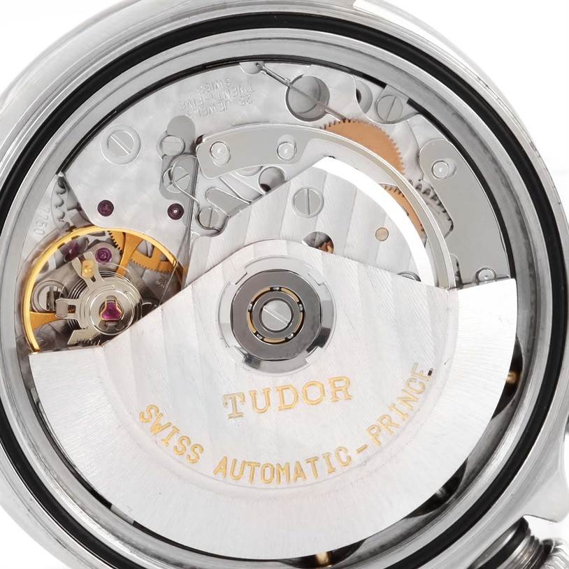 The image shows a close-up of the internal movement mechanisms of the Tudor Tiger 79280 Men's Stainless Steel Burgundy Dial 79280 Men's Stainless Steel Burgundy Dial model watch.
