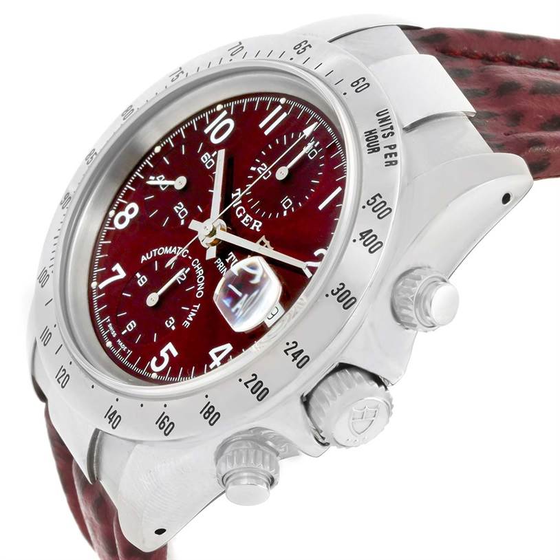 The image shows a Tudor Tiger 79280 Men's Stainless Steel Burgundy Dial 79280 Men's Stainless Steel Burgundy Dial model watch at a slight angle, with a red dial, bezel, crown, pushers, and part of the strap visible.