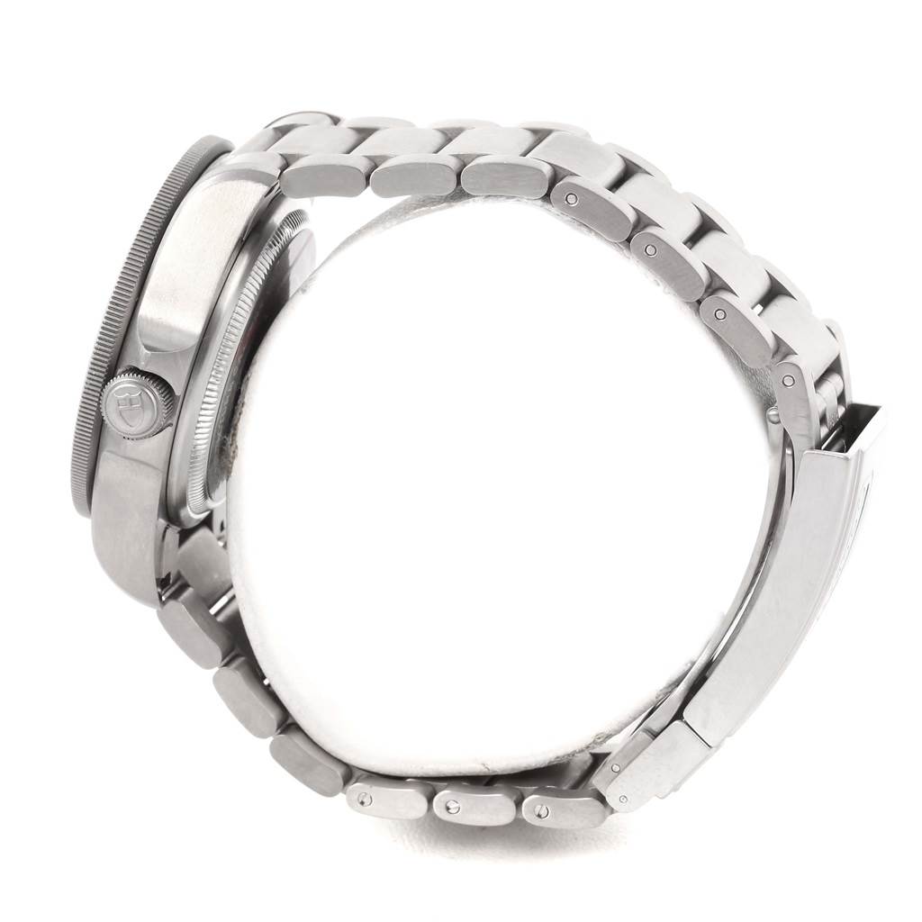 The image shows a side view of the Tudor Pelagos 25600TB Men's Titanium Blue Dial 25600TB Men's Titanium Blue Dial watch, focusing on its crown, case, and metal bracelet.