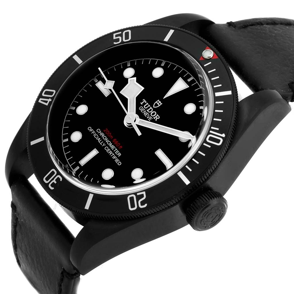 The image shows a close-up side angle of the Tudor Heritage Black Bay 79230DK Men's Stainless Steel Black Dial 79230DK Men's Stainless Steel Black Dial watch, highlighting the bezel, crown, and part of the strap.