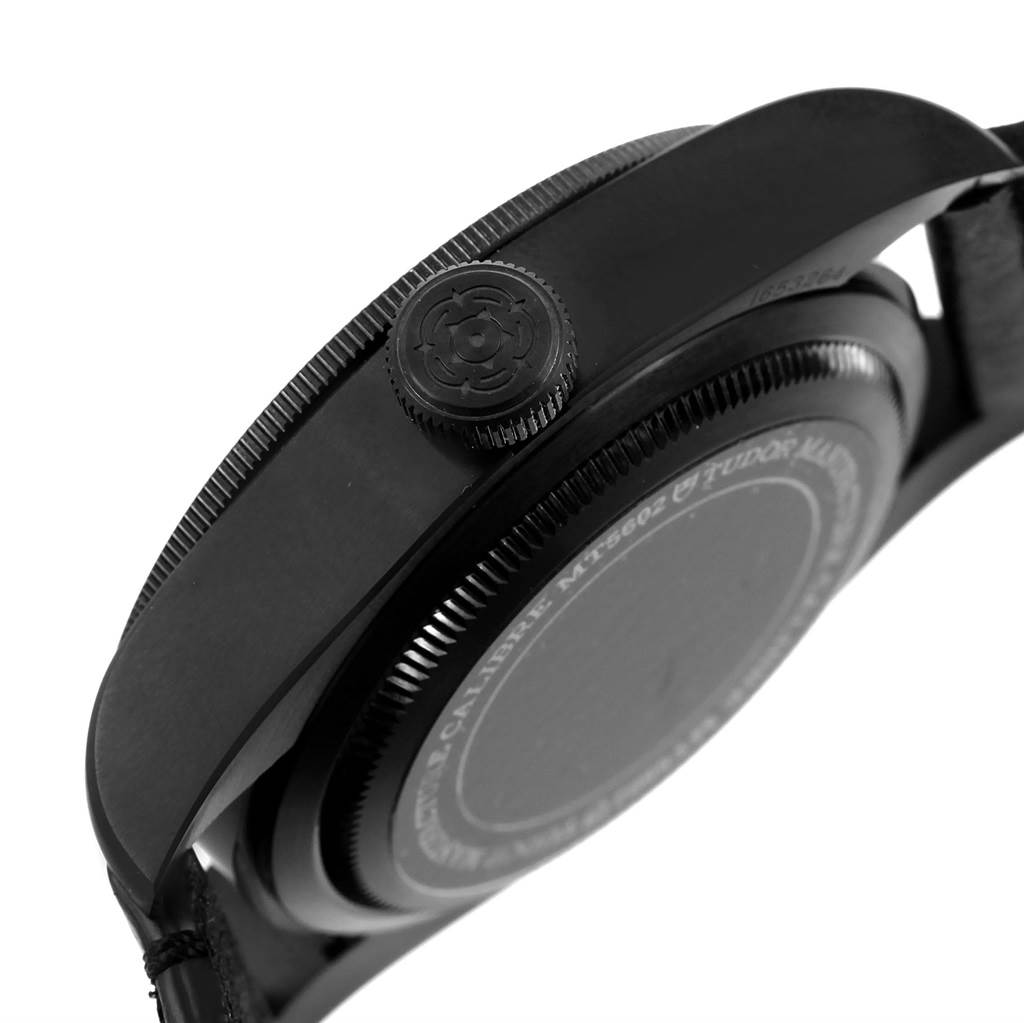 The image shows a side view of the Tudor Heritage Black Bay 79230DK Men's Stainless Steel Black Dial 79230DK Men's Stainless Steel Black Dial model, focusing on the crown and caseback.