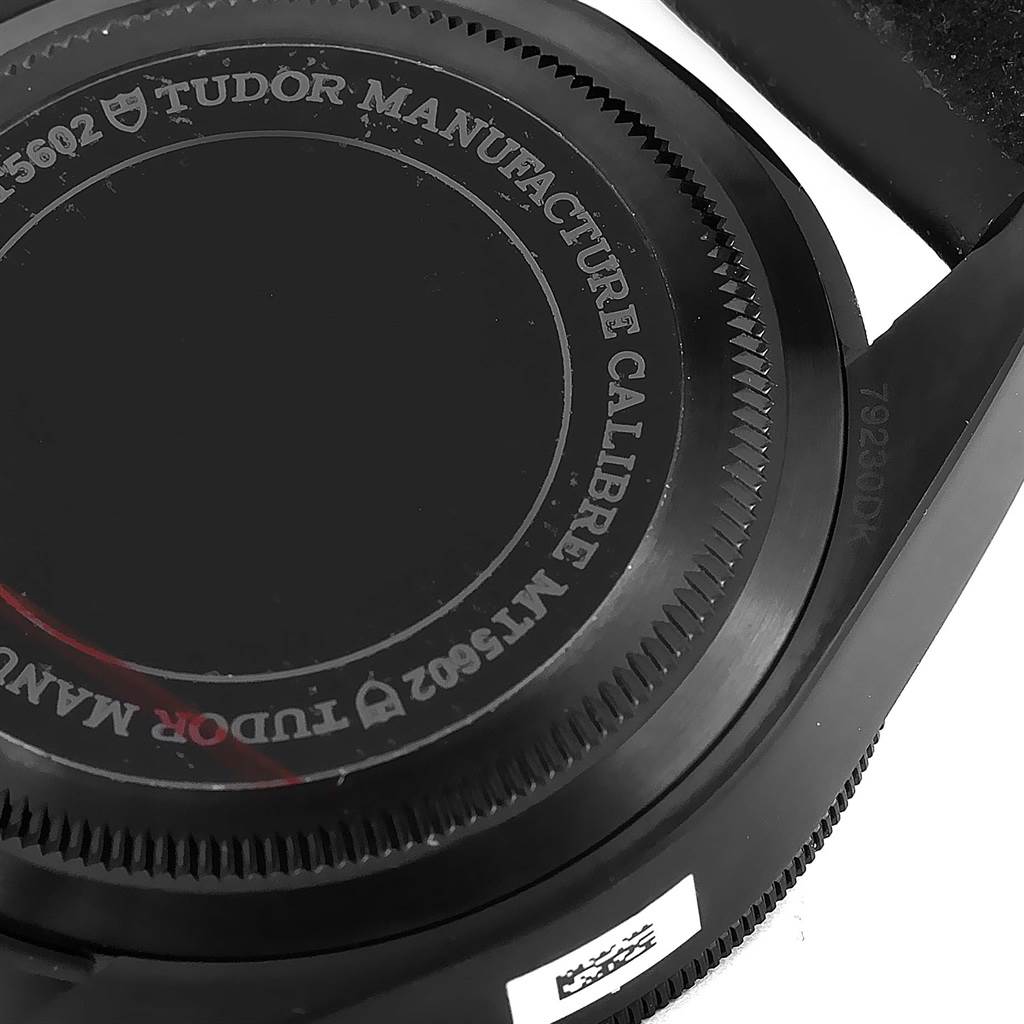 The image shows the bottom side of a Tudor Heritage Black Bay 79230DK Men's Stainless Steel Black Dial 79230DK Men's Stainless Steel Black Dial watch, focusing on the case back.